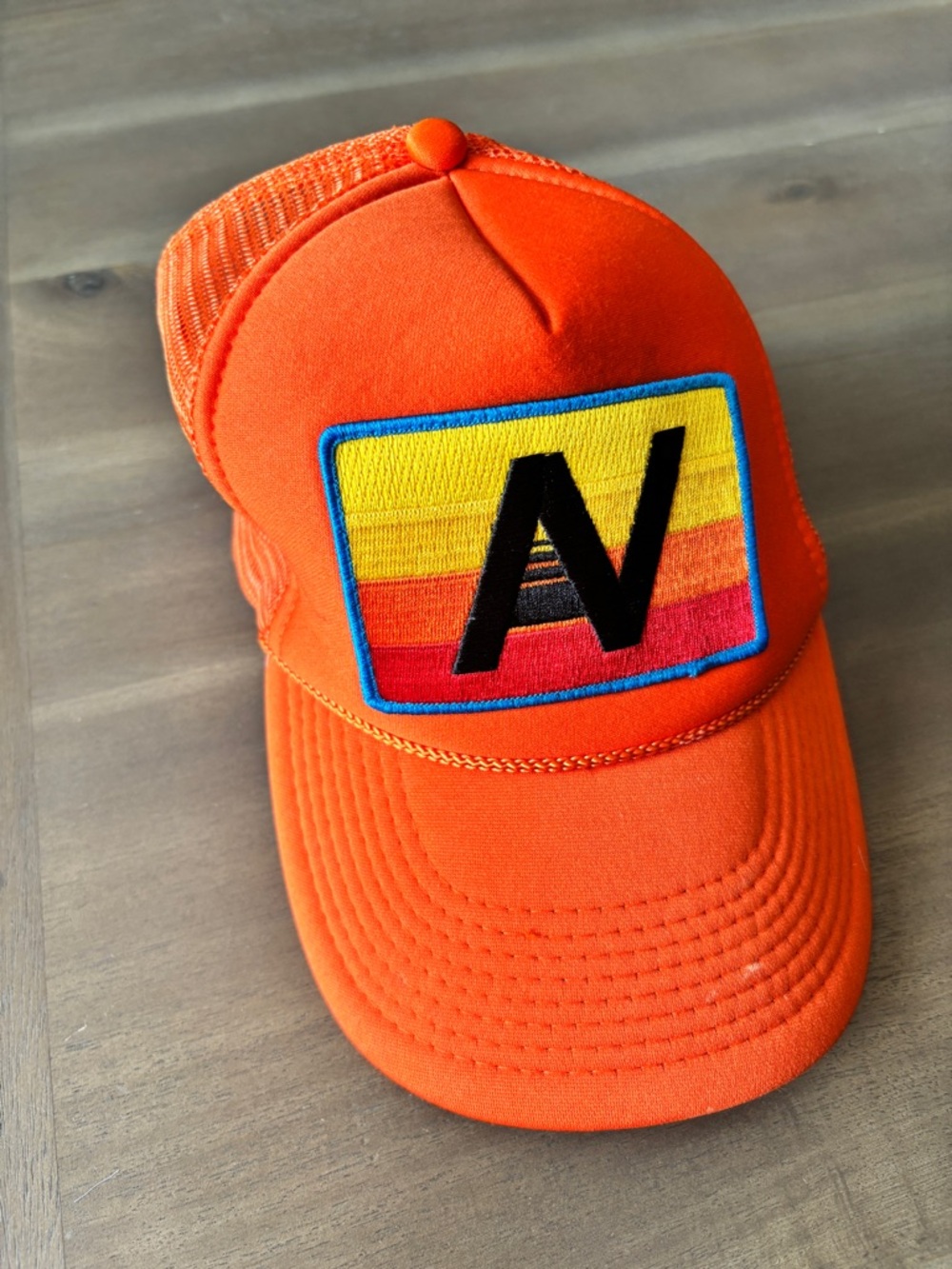Aviator Nation Orange Trucker Cap with Rainbow 'AN' Logo